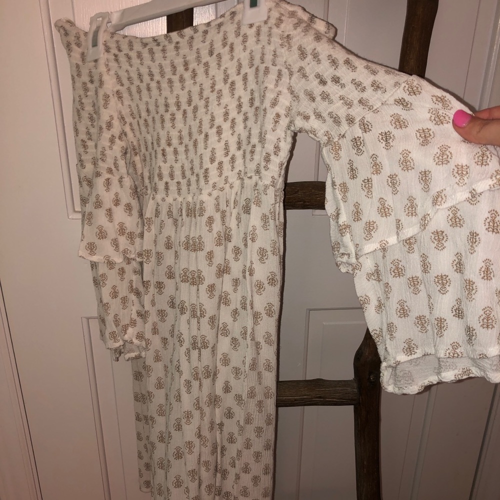 White beach cover up with pattern throughout